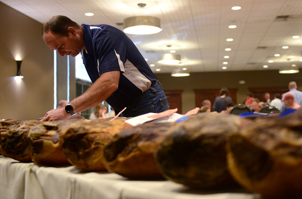 Bryon Salmon examines the awarded hams